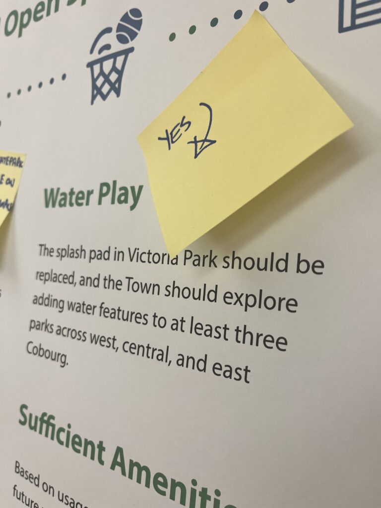 Sticky note comment on a draft master plan board about water play