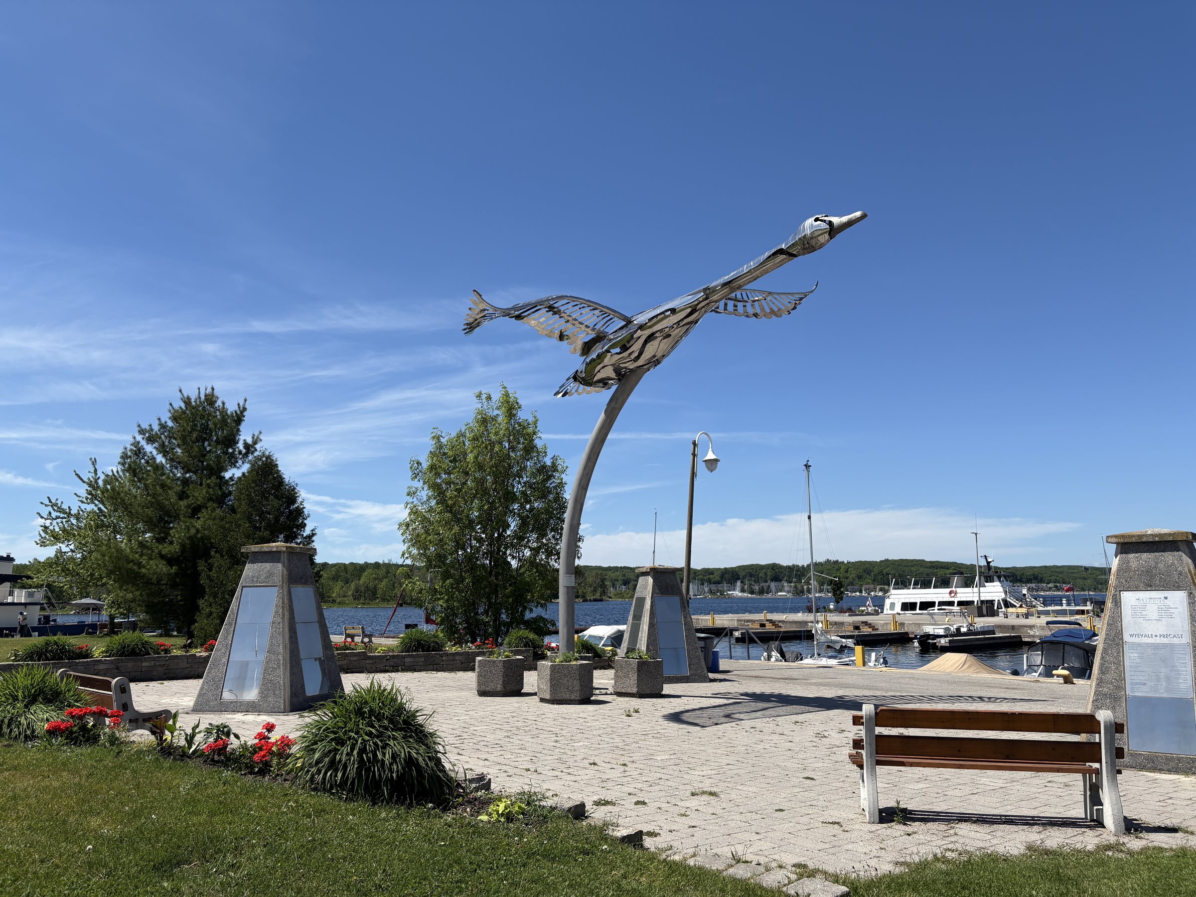 Metal bird sculpture and memorial stones at the Midland Town Dock on Georgian Bay